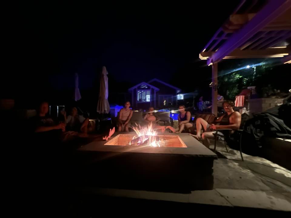 Our latest fire pit project with the client’s family connecting and conversing outdoors.