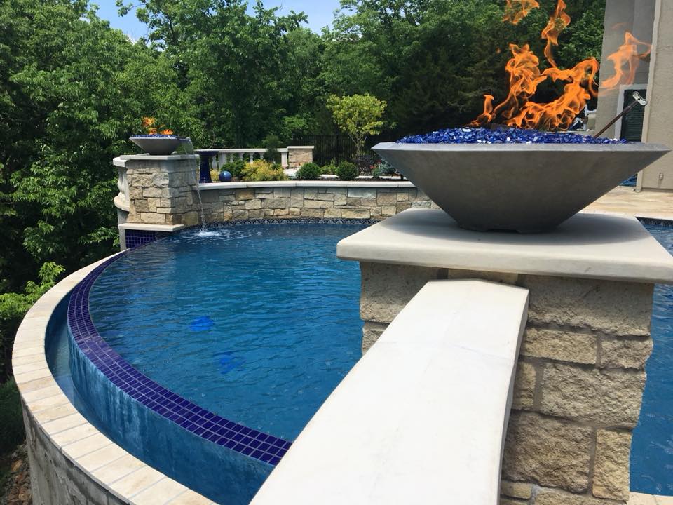 A fire bowl over an infinity pool.