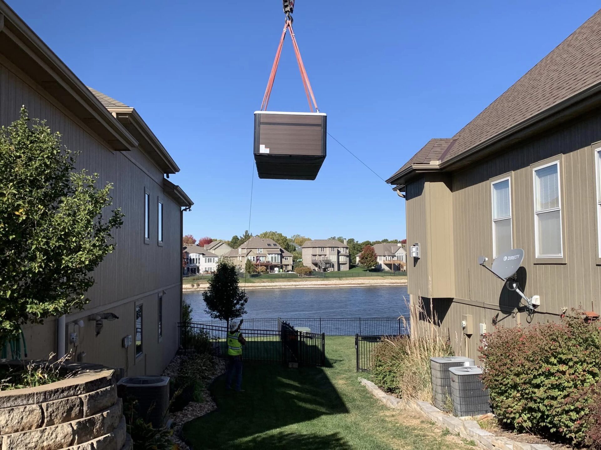 A pool made from a shipping container being installed.