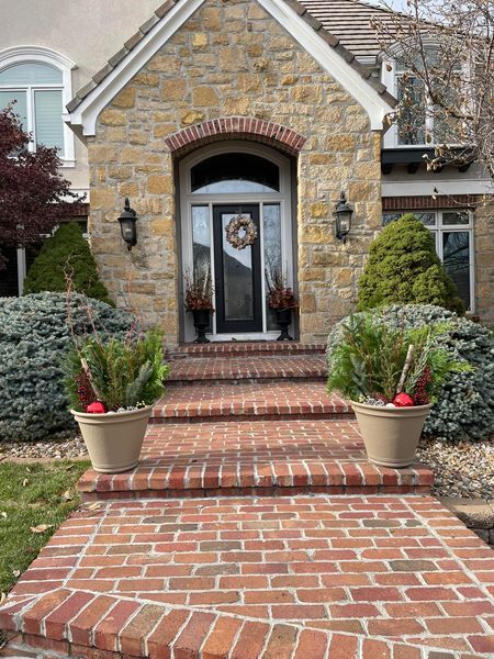 Planters flank this door and frame it for visitors. 