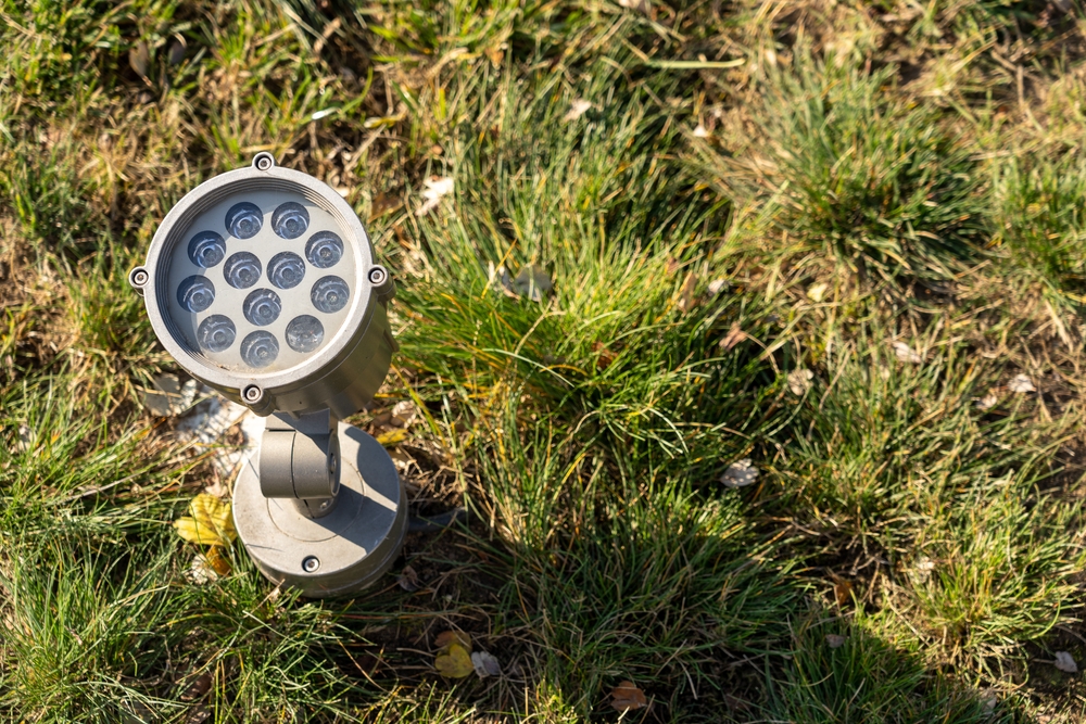 an outdoor light on the grass