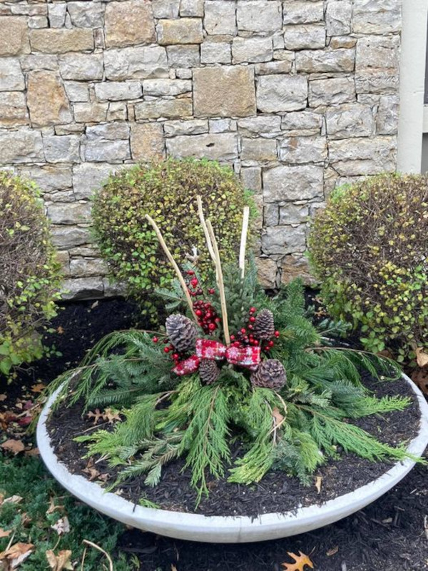 A cheerful holiday-themed wide planter. 